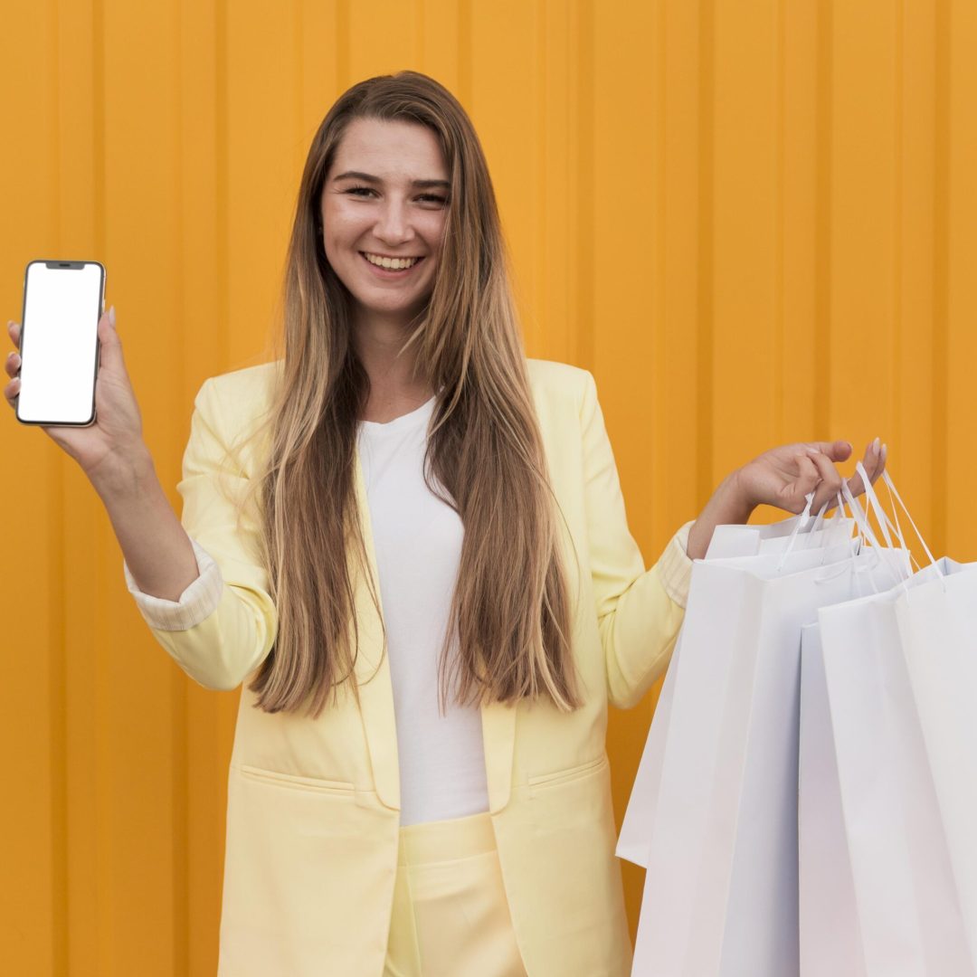 young-client-wearing-yellow-clothes-holding-phone